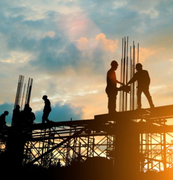 Silhouette,Of,Engineer,And,Construction,Team,Working,At,Site,Over